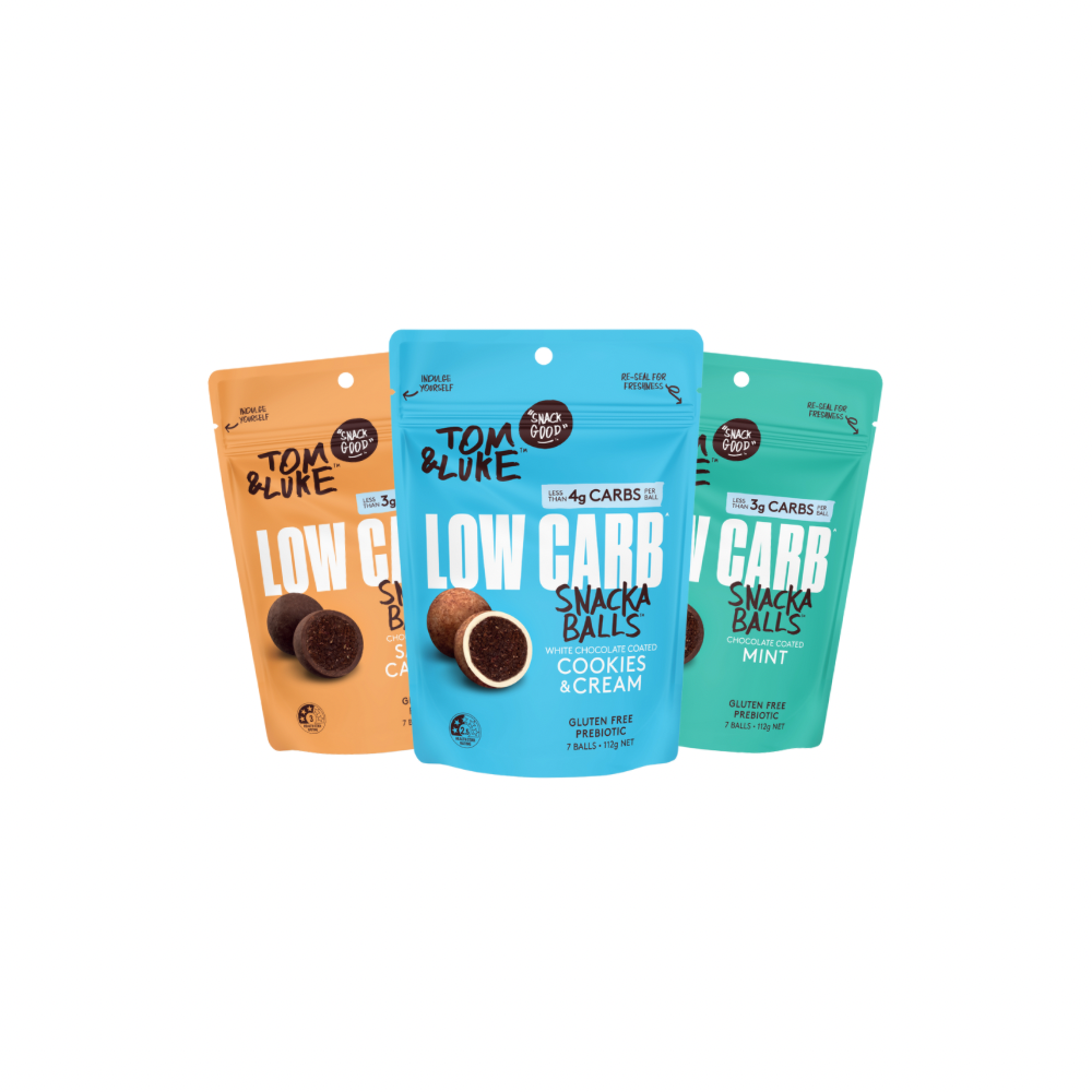 Three packages of Chocolate coated Tom & Luke Low Carb Snack Balls on a white background. Cookies and Cream, Salted Caramel and Mint. Delicious and nutritious healthy snacks from New Zealand. 